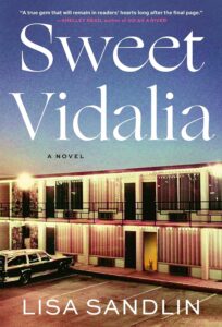 Sweet Vidilia by Lisa Sandolin. Featuring a two story apartment building in front of a sunset. A car is parked in front.