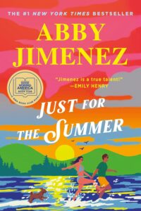 Just for the Summer by Abby Jimenez. Featuring a couple and a dog on a beach in front of a lake.